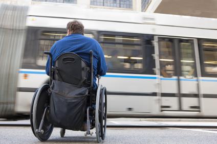 Man-using-wheelchair-waiting-for-Metrorail-train