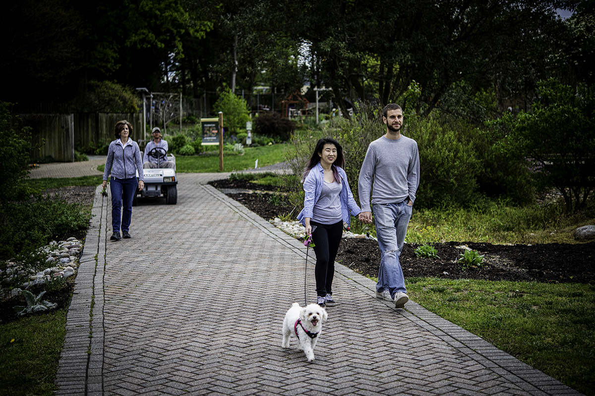 Photo of a couple and a single woman enjoying a walk around Green Springs Garden in Alexandria 
