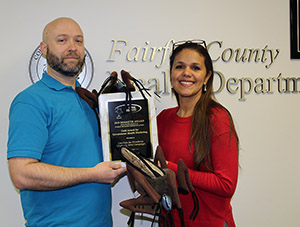Josh Smith and Carla Paredes pose with the 2019 Berreth Award