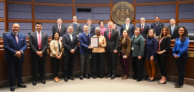 Dr. Gloria Addo-Ayensu and other Health Department staff accepting the proclamation from the Board of Supervisors