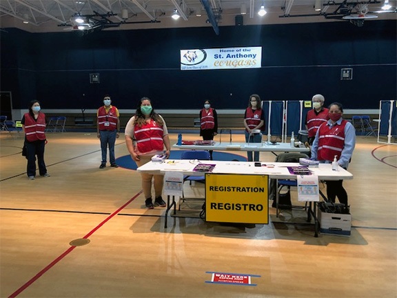 Medical Reserve Corps volunteers stand ready to help at a past vaccine clinic
