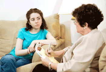 Photo of teen girl talking with therapist