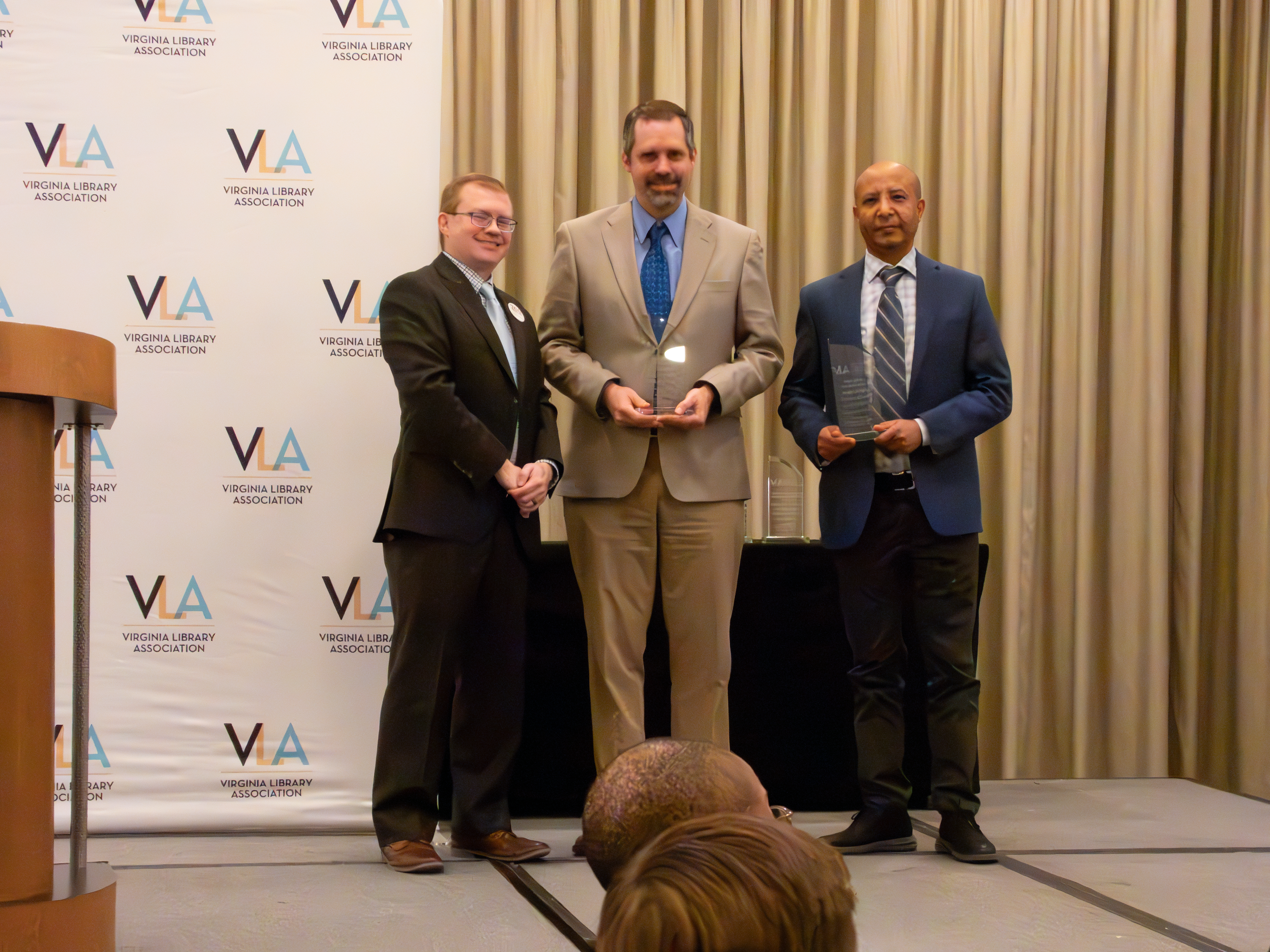 Gary Goodson and Atnaf Ameha accept the Public Library Innovator Award at the 2023 VLA Awards Banquet