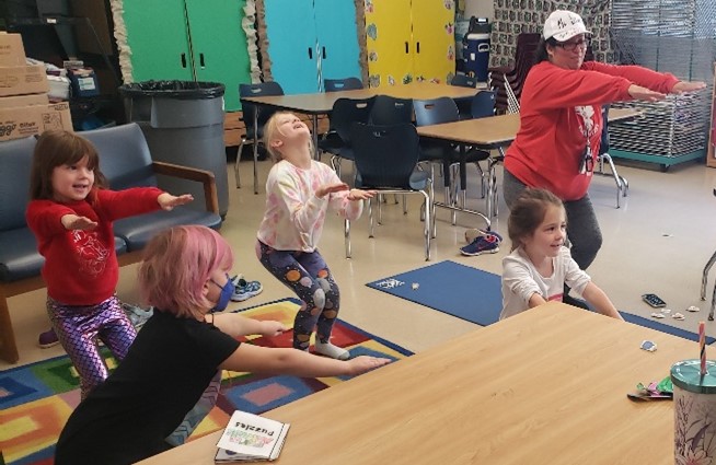 Children exercising with a teacher at Westlawn SACC 