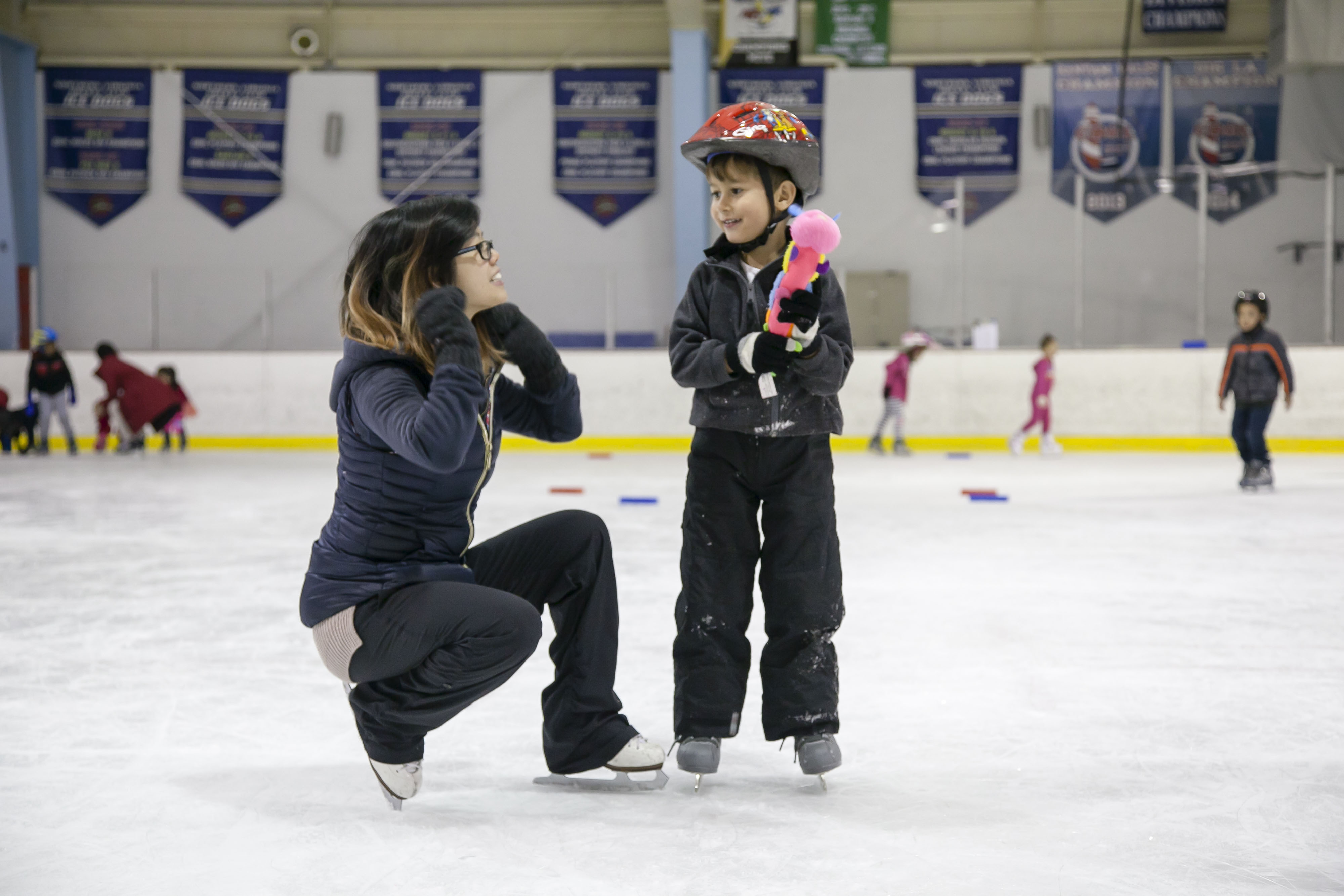 Coach conducting a private skating class to a student