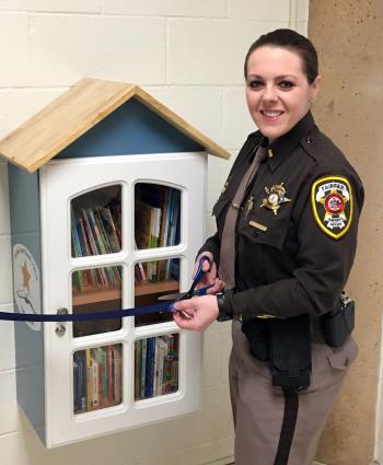 2nd Lt. Fary cuts ribbon on new Little Library