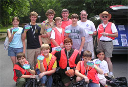 boy scout group holds up storm drain labels