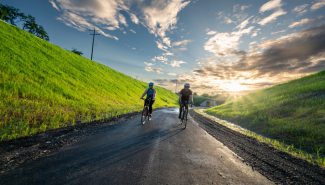 Image of two cyclists riding on the I66 Parallel Trail