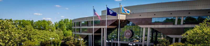 large building with flags waving in the breeze