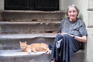 woman and cat on steps