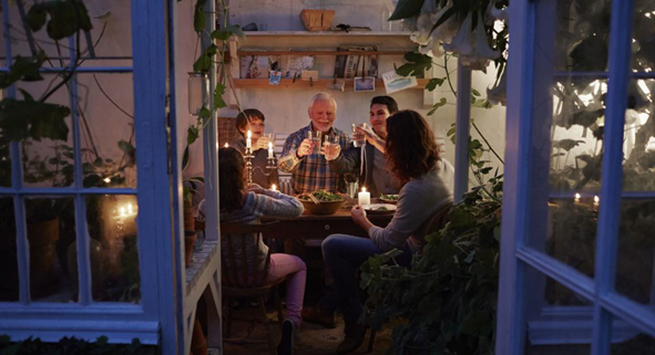 people sitting at table in home