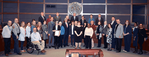 Photo of group receiving Developmental Disabilities Inclusion Month proclamation