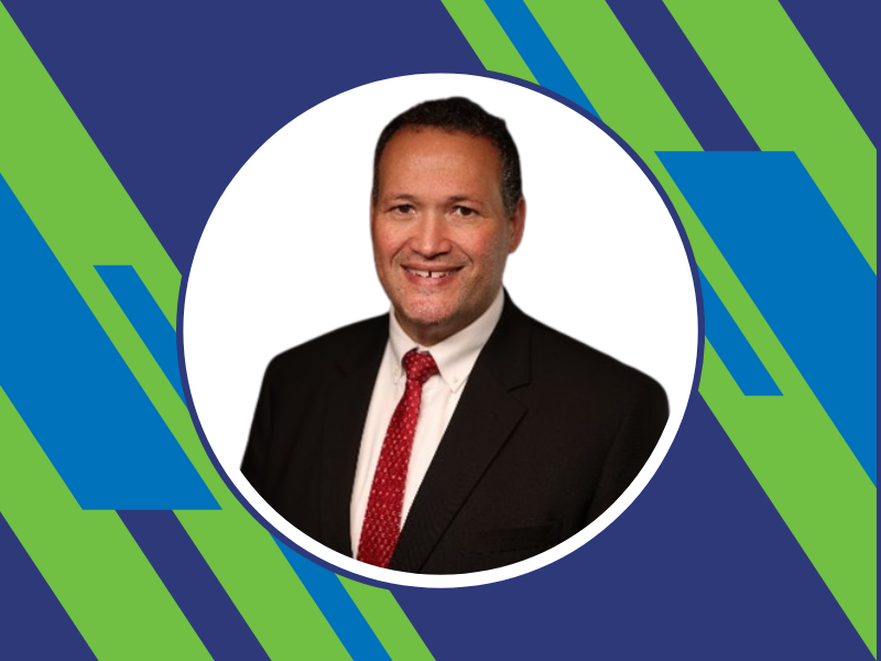 A profile photo of a man in a suit.