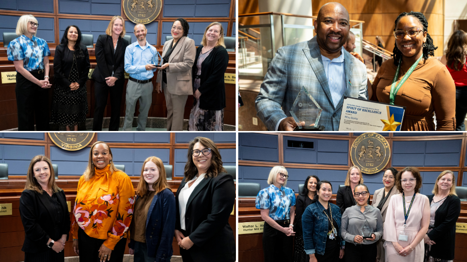 People stand and smile at the Government Center with their SOE awards