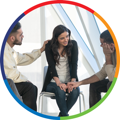 a woman speaking to a support group