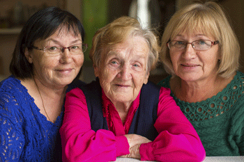 Photo of elderly woman with two adult daughters