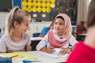 Photo of two girls in an elementary school classroom