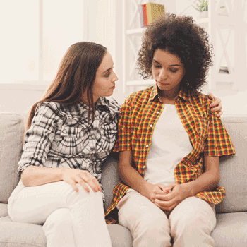 Photo of woman comforting a friend