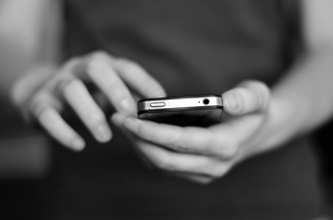 Photo of hands holding smart phone