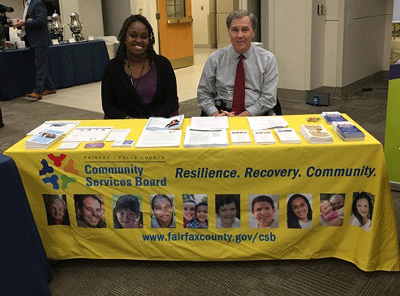 Photo of staff at CSB display table