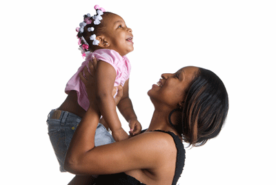 Photo of woman holding toddler up in the air