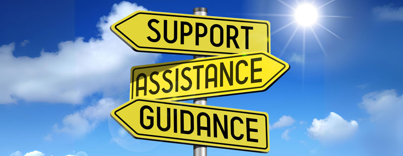 An illustration of three street signs pointing in different directions with the words 'Support', 'Assistance', and 'Guidance' on them.