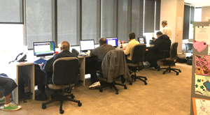 Photo of people working at computers at Peer Resource Center