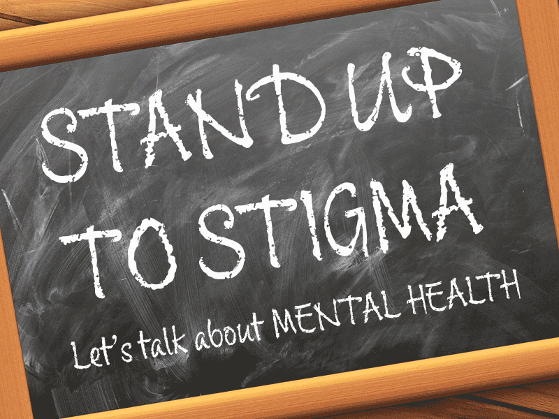 Chalkboard with quote - Stand up to stigma - let's talk about mental health - end quote - written on it