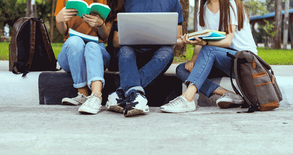 Photo of students on college campus studying together