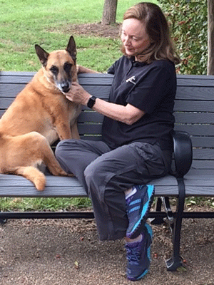 Photo of woman petting a dog