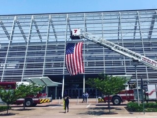 Photo of building with fire trucks and American flag