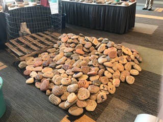 Photo of large pile of rocks with hopeful messages written on them