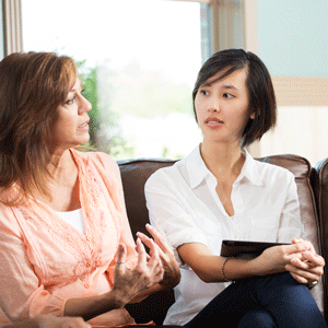 Photo of two women talking