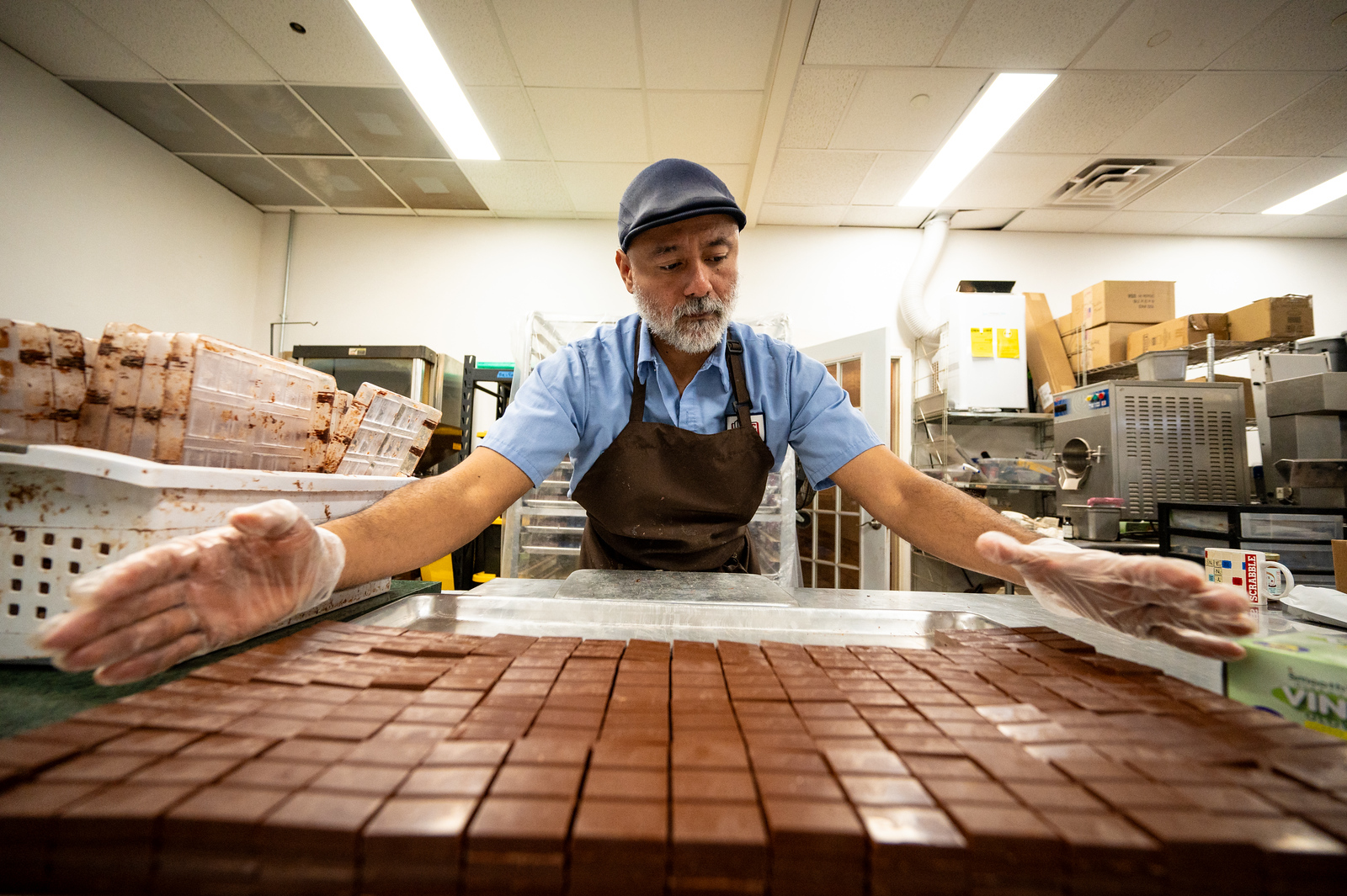 man showing the process of making chocolates