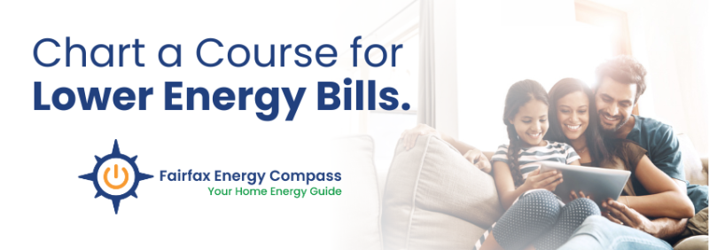 photo of two people looking at bills and smiling with the fairfax energy compass logo overlaid