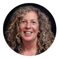 woman with blond curly hair headshot