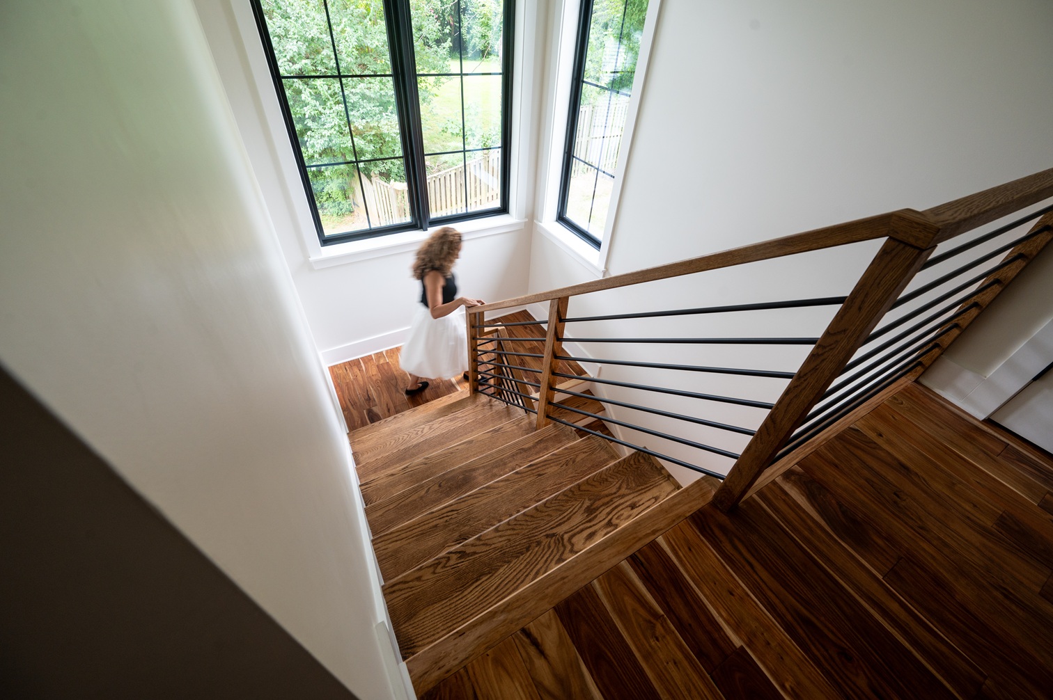 photo of a woman descending staircase, showing motion