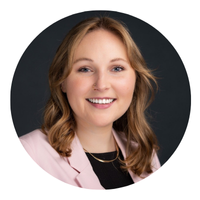 photo of blonde woman with pink shirt in headshot