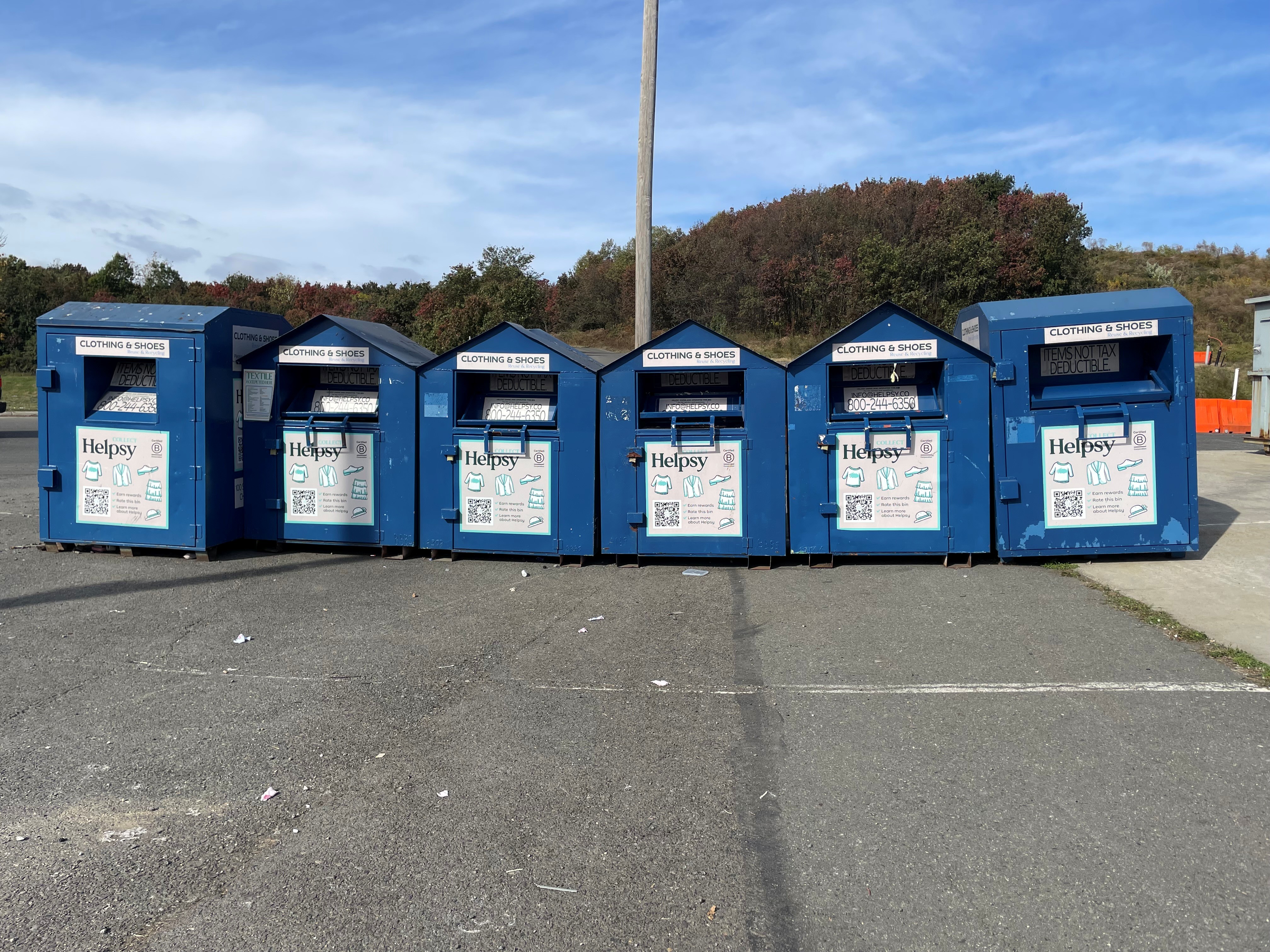 large blue helpsy containers lined up