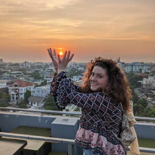 maiya justice posing with a sunset