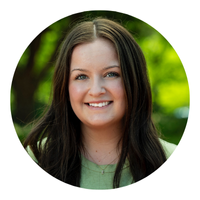 photo of brunette woman with green shirt