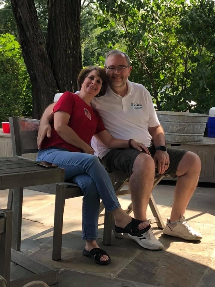 chris miles and his wife, susan sitting outside