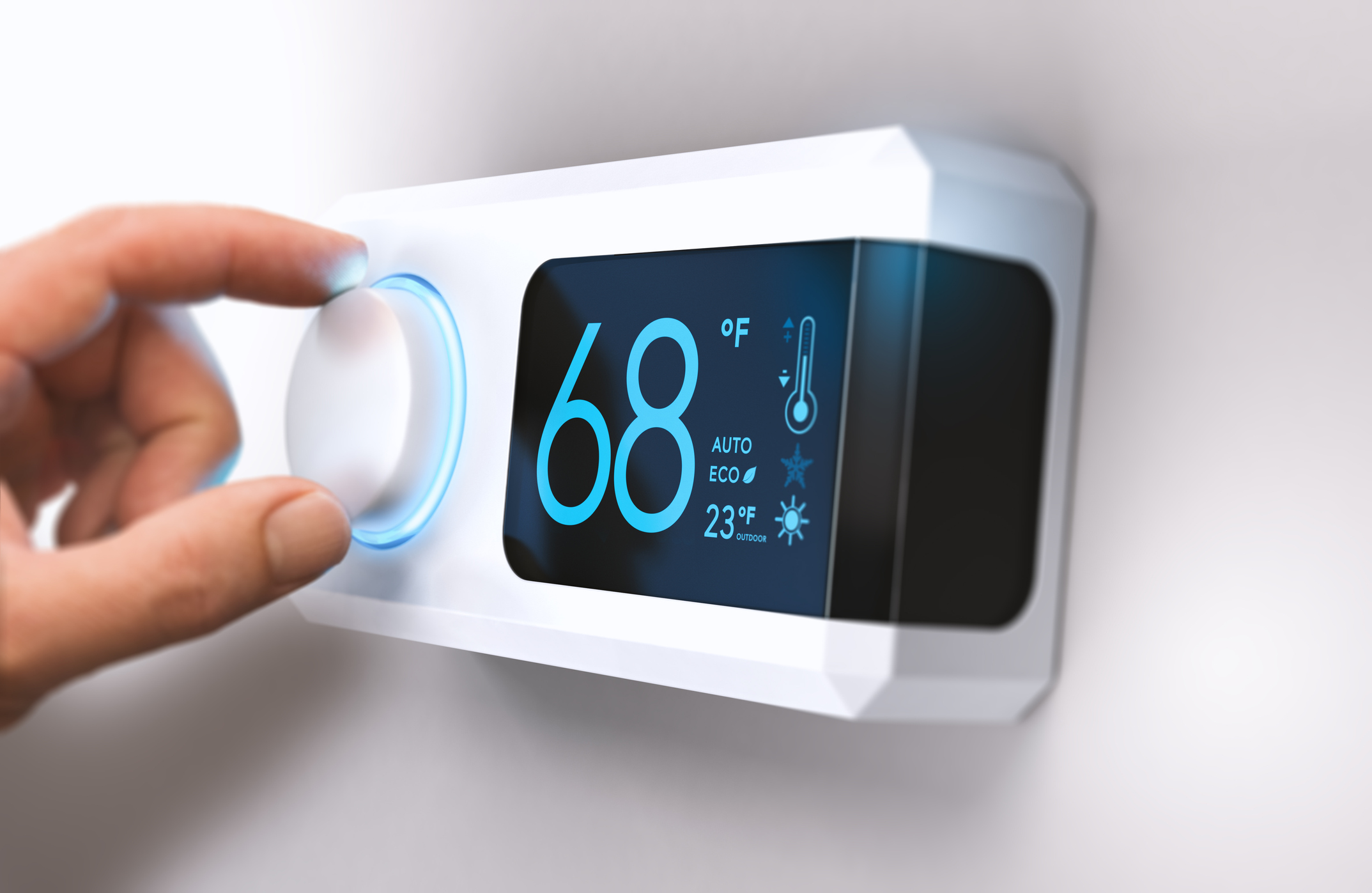 thermostat showing 68 degrees being turned down