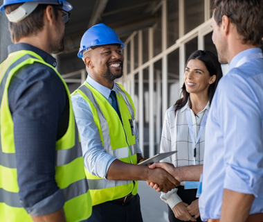 handshake at construction site