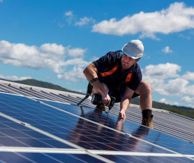 man installing solar panel