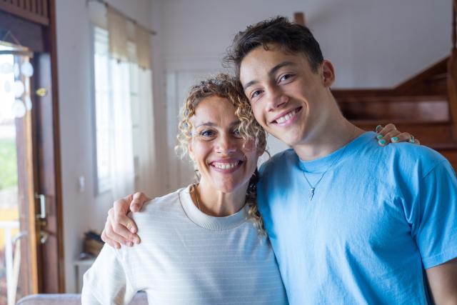 mother and teen son smiling