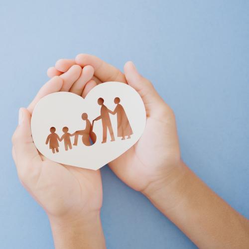 hands holding cut out heart