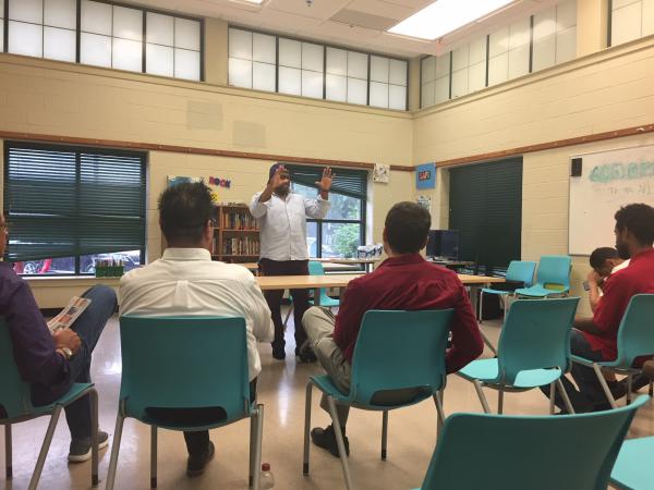 2018 August Dads' Parenting Group Graduation; teacher and participants in class