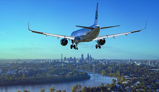 airplane flying over city