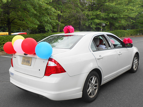 vehicle decorated with balloons